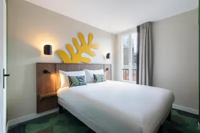 Un ou plusieurs lits dans un hébergement de l'établissement Ibis Styles Paris Jardin de la Villette - Rénové en 2025