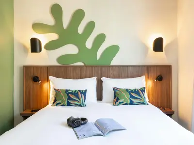 Un ou plusieurs lits dans un hébergement de l'établissement Ibis Styles Paris Jardin de la Villette - Rénové en 2025