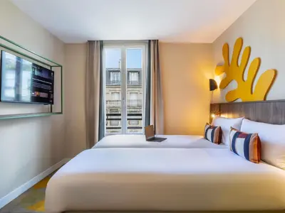 Un ou plusieurs lits dans un hébergement de l'établissement Ibis Styles Paris Jardin de la Villette - Rénové en 2025