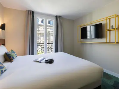 Un ou plusieurs lits dans un hébergement de l'établissement Ibis Styles Paris Jardin de la Villette - Rénové en 2025