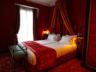 Un ou plusieurs lits dans un hébergement de l'établissement La Villa Royale