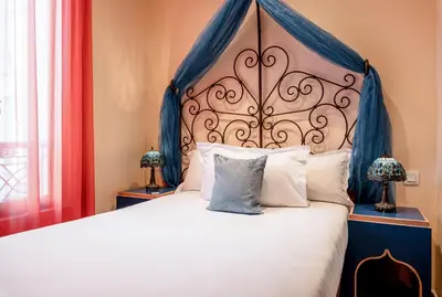Un ou plusieurs lits dans un hébergement de l'établissement Villa Royale Montsouris