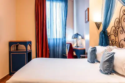 Un ou plusieurs lits dans un hébergement de l'établissement Villa Royale Montsouris