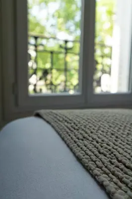 Un ou plusieurs lits dans un hébergement de l'établissement Hotel Courseine