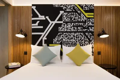 Un ou plusieurs lits dans un hébergement de l'établissement Drawing Hotel