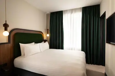 Un ou plusieurs lits dans un hébergement de l'établissement Hotel Le Richemont