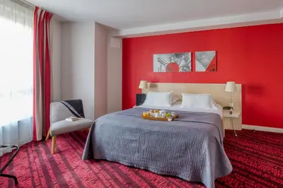 Un ou plusieurs lits dans un hébergement de l'établissement Hotel Le Richemont