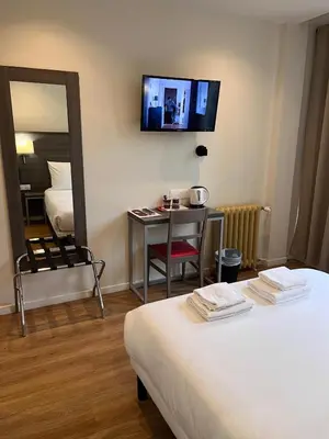 Un ou plusieurs lits dans un hébergement de l'établissement Hipotel Paris Voltaire Bastille