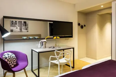 Télévision ou salle de divertissement dans l'établissement Citadines Opéra Paris