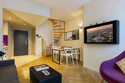 Télévision ou salle de divertissement dans l'établissement Citadines Opéra Paris