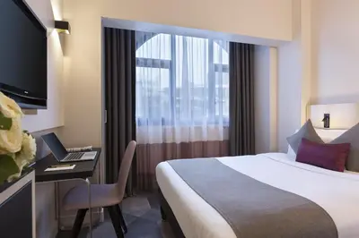 Télévision ou salle de divertissement dans l'établissement Citadines Trocadéro Paris