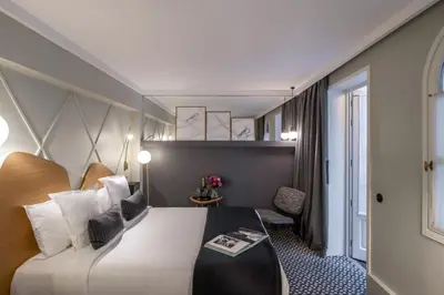 Un ou plusieurs lits dans un hébergement de l'établissement Millésime Hôtel