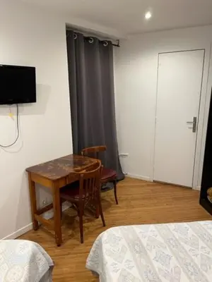 Télévision ou salle de divertissement dans l'établissement Hotel Luna Park