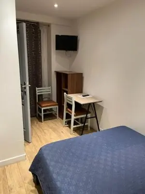 Télévision ou salle de divertissement dans l'établissement Hotel Luna Park