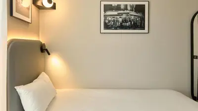 Un ou plusieurs lits dans un hébergement de l'établissement Campanile PRIME - Paris Ouest Boulogne
