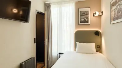Un ou plusieurs lits dans un hébergement de l'établissement Campanile PRIME - Paris Ouest Boulogne