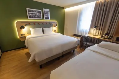 Un ou plusieurs lits dans un hébergement de l'établissement Campanile Prime Paris 19 - La Villette