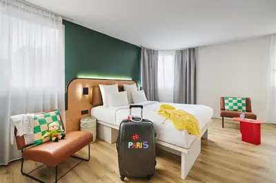 Un ou plusieurs lits dans un hébergement de l'établissement Moxy Paris Bastille