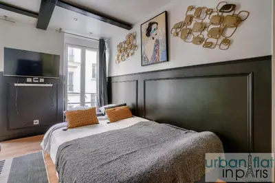 Un ou plusieurs lits dans un hébergement de l'établissement 13 Luxury Flat eiffel design 2