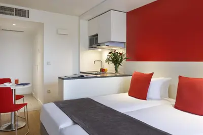 Un ou plusieurs lits dans un hébergement de l'établissement Citadines Montparnasse Paris