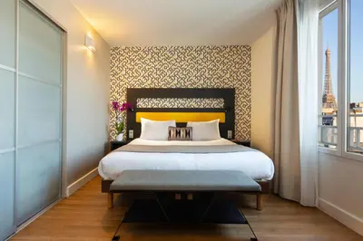 Un ou plusieurs lits dans un hébergement de l'établissement Citadines Tour Eiffel Paris