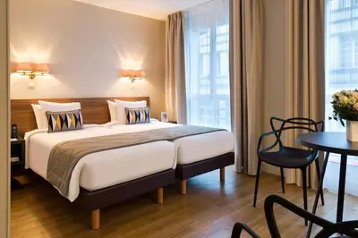 Un ou plusieurs lits dans un hébergement de l'établissement Citadines Tour Eiffel Paris
