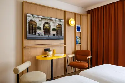 Un ou plusieurs lits dans un hébergement de l'établissement Citadines République Paris