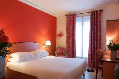 Un ou plusieurs lits dans un hébergement de l'établissement Hotel Eden Montmartre
