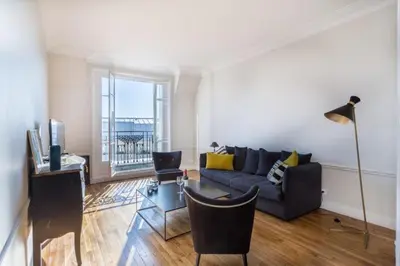 Coin salon dans l'établissement GuestReady - Designer Apartment - Eiffel Tower View!