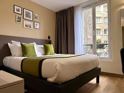Un ou plusieurs lits dans un hébergement de l'établissement Best Western Hotel Le Montparnasse