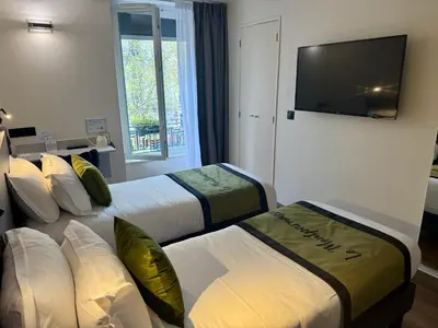 Un ou plusieurs lits dans un hébergement de l'établissement Best Western Hotel Le Montparnasse