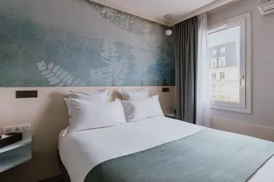 Un ou plusieurs lits dans un hébergement de l'établissement Hotel Apolonia Paris Mouffetard, Sure Hotel Collection by Best Western