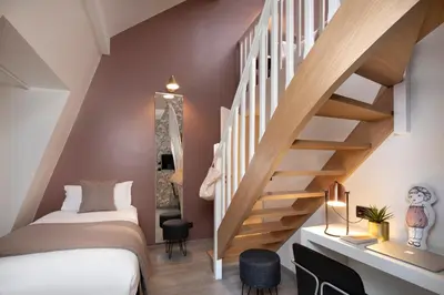 Un ou plusieurs lits dans un hébergement de l'établissement Hôtel Brady