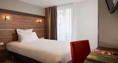 Un ou plusieurs lits dans un hébergement de l'établissement Hotel Apolonia Paris Montmartre; Sure Hotel Collection by Best Western