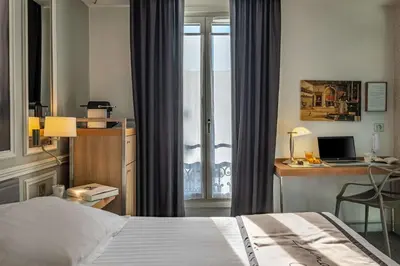 Un ou plusieurs lits dans un hébergement de l'établissement Hotel Litteraire Le Swann, BW Premier Collection