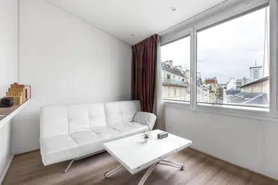 Coin salon dans l'établissement Modern Apartment in the Heart of the Marais
