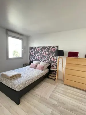 Un ou plusieurs lits dans un hébergement de l'établissement Cosy appart proche Paris