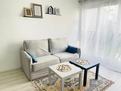 Coin salon dans l'établissement Cosy appart proche Paris