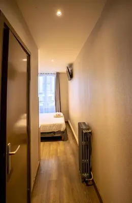 Un ou plusieurs lits dans un hébergement de l'établissement Hotel Aix Europe