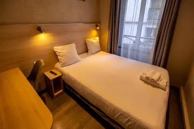 Un ou plusieurs lits dans un hébergement de l'établissement Hotel Aix Europe