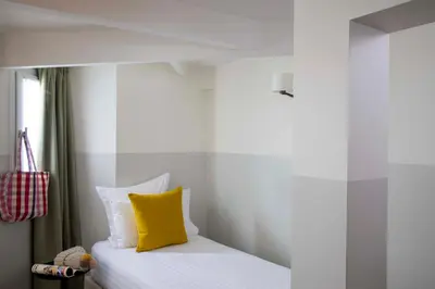 Un ou plusieurs lits dans un hébergement de l'établissement Hôtel Des Mines