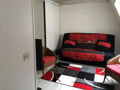 Coin salon dans l'établissement Cosy Holidays Room