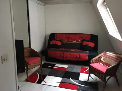 Coin salon dans l'établissement Cosy Holidays Room