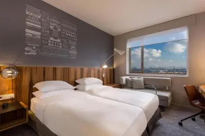 Un ou plusieurs lits dans un hébergement de l'établissement Hyatt Regency Paris Etoile