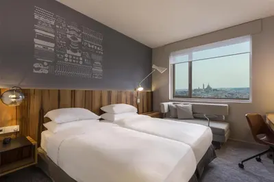Un ou plusieurs lits dans un hébergement de l'établissement Hyatt Regency Paris Etoile