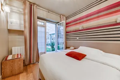 Un ou plusieurs lits dans un hébergement de l'établissement Le Vert Galant - Auberge Etchegorry