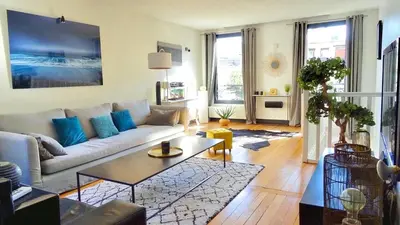 Coin salon dans l'établissement Le duplex de la reine - lesparisnormands