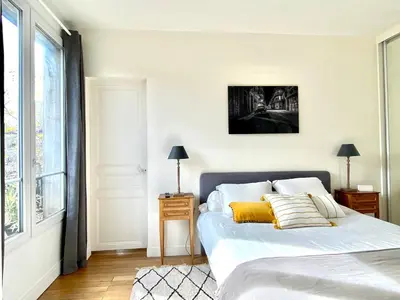 Un ou plusieurs lits dans un hébergement de l'établissement Le duplex de la reine - lesparisnormands