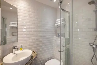 Salle de bains dans l'établissement Hôtel L'Interlude