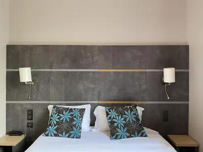 Un ou plusieurs lits dans un hébergement de l'établissement Timhotel Boulogne Rives de Seine